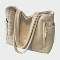 Lumina Wear Tilda minimalist tote bag in green, featuring a spacious interior and sleek design for everyday use.