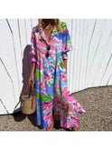 Colorful Trishia Vibrant Bloom Dress by Lumina Wear, featuring a multicolor floral pattern and lightweight fabric on a model.
