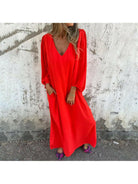 Red-orange Trixy™ Maxi Dress by Lumina Vancouver, flowing fabric and elegant design, perfect for summer occasions.