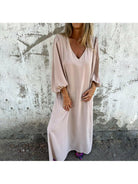 Red-orange Trixy™ maxi dress by Lumina Vancouver, flowing design, perfect for summer or casual occasions.