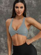 Black Twist Hollow Out Sports Bra by Lumina Vancouver, stylish and supportive activewear for workouts.
