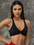 Black Lumina Vancouver Twist Hollow Out Sports Bra featuring a stylish twist design and breathable fabric for active wear.