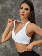 White Lumina Vancouver Twist Hollow Out Sports Bra with fishnet cutout design, featuring a stylish and breathable athletic bra.