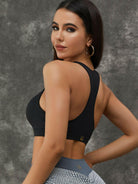 White Lumina Vancouver sports bra with twist hollow out and fishnet cutout design, showcasing breathable and stylish activewear.