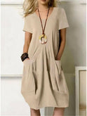 Orange Lumina Wear Ubud casual dress displayed on a mannequin, featuring a relaxed fit and stylish design.