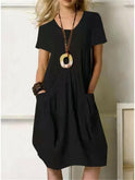 Orange Lumina Wear Ubud casual dress with short sleeves and fitted waist, displayed on a mannequin.
