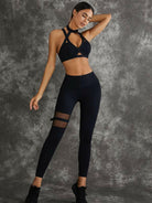Black Lumina Vancouver sports bra with unique cut-out design, featuring a supportive fit and stylish athletic look.