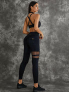 Black Lumina Vancouver sports bra with unique cut-out design, featuring a supportive fit for active wear.