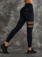 Black Lumina Vancouver sports bra with unique cut-out design, offering stylish support for active wear.