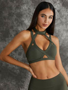 Black Lumina Vancouver sports bra with unique cut-out design, offering stylish support for active wear.