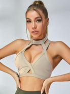 Multicolor Lumina Vancouver cut-out sports bras in black, pink, blue, and purple with unique design details.