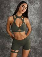 Dark sea green Lumina Vancouver sports bras with unique cut-out design, shown in a bundle, for activewear and workout comfort.