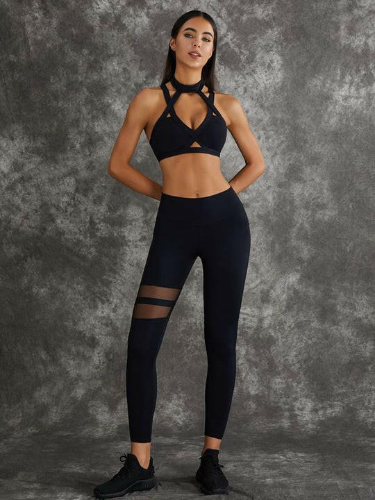 Dark sea green Lumina Vancouver sports bras with unique cut-out design, shown in a bundle on a plain background.