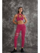 Dark sea green Lumina Vancouver sports bras with unique cut-out design, shown in a bundle.