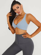 Black Lumina Vancouver V-neck beauty back sports bra with supportive design and stylish fit, ideal for active wear.