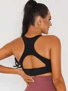 Black Lumina Vancouver V-neck sports bra with a stylish open back and supportive fit, designed for active wear.