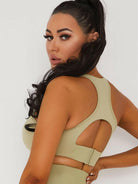 Khaki V-neck sports bra by Lumina Vancouver, designed for comfort and support during athletic activities.
