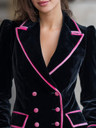 Black velvet blazer with pink contrast trim from Lumina Wear, featuring a tailored fit and stylish lapel details.