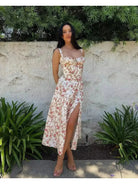 Venura spring wedding guest dress by Lumina Vancouver, white floral print, lightweight fabric, perfect for spring events and celebrations.