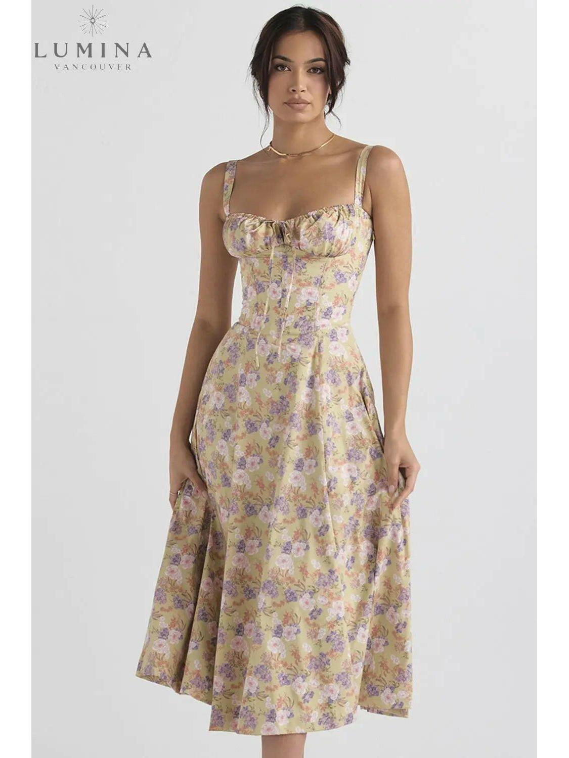 White Venura spring wedding guest dress by Lumina Vancouver with floral print, perfect for spring and summer occasions.