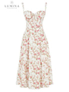 White Venura spring wedding guest dress by Lumina Vancouver featuring a floral print, perfect for elegant occasions.