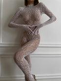 Black Jeannette Lace Bodysuit by Lumina Wear, featuring intricate lace details and a fitted design on a model.