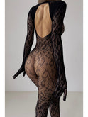 Black Idalie Transparent Bodysuit by Lumina Wear featuring sheer fabric and fitted design, displayed on a model.