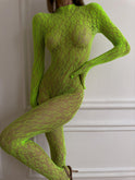 Black Idalie Transparent Bodysuit by Lumina Wear featuring sheer fabric and fitted design, displayed on a mannequin.