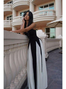 Black and white Viara maxi dress by Lumina Vancouver featuring a paneled design and flowing silhouette.