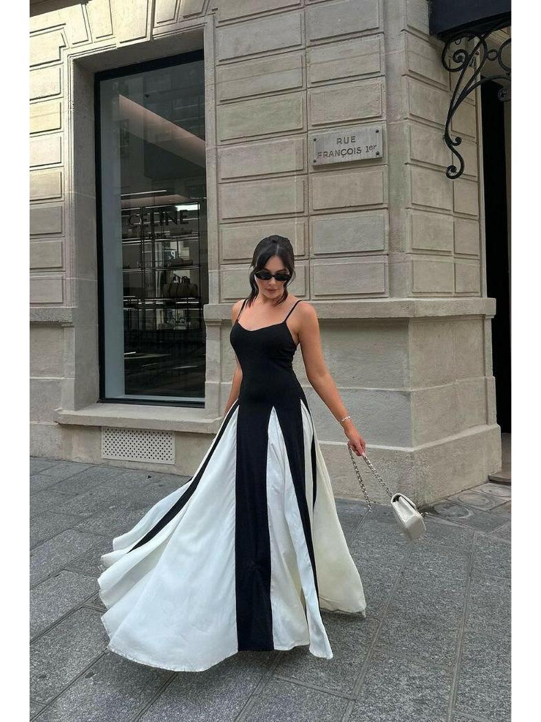 Black and white Viara paneled maxi dress by Lumina Vancouver, featuring flowing fabric and stylish panel design.