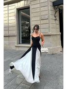 Black and white Viara paneled maxi dress by Lumina Vancouver, featuring a flowing silhouette and stylish panel details.