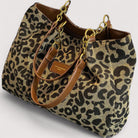 Victoria bold leopard print canvas shopping bag by Lumina Wear, featuring spacious design and sturdy handles.