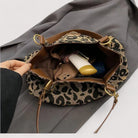 Lumina Wear Victoria leopard print canvas shopping bag with sturdy handles and bold animal pattern for fashionable everyday use.