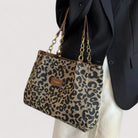 Victoria bold leopard print canvas shopping bag by Lumina Wear, featuring spacious design and sturdy handles.