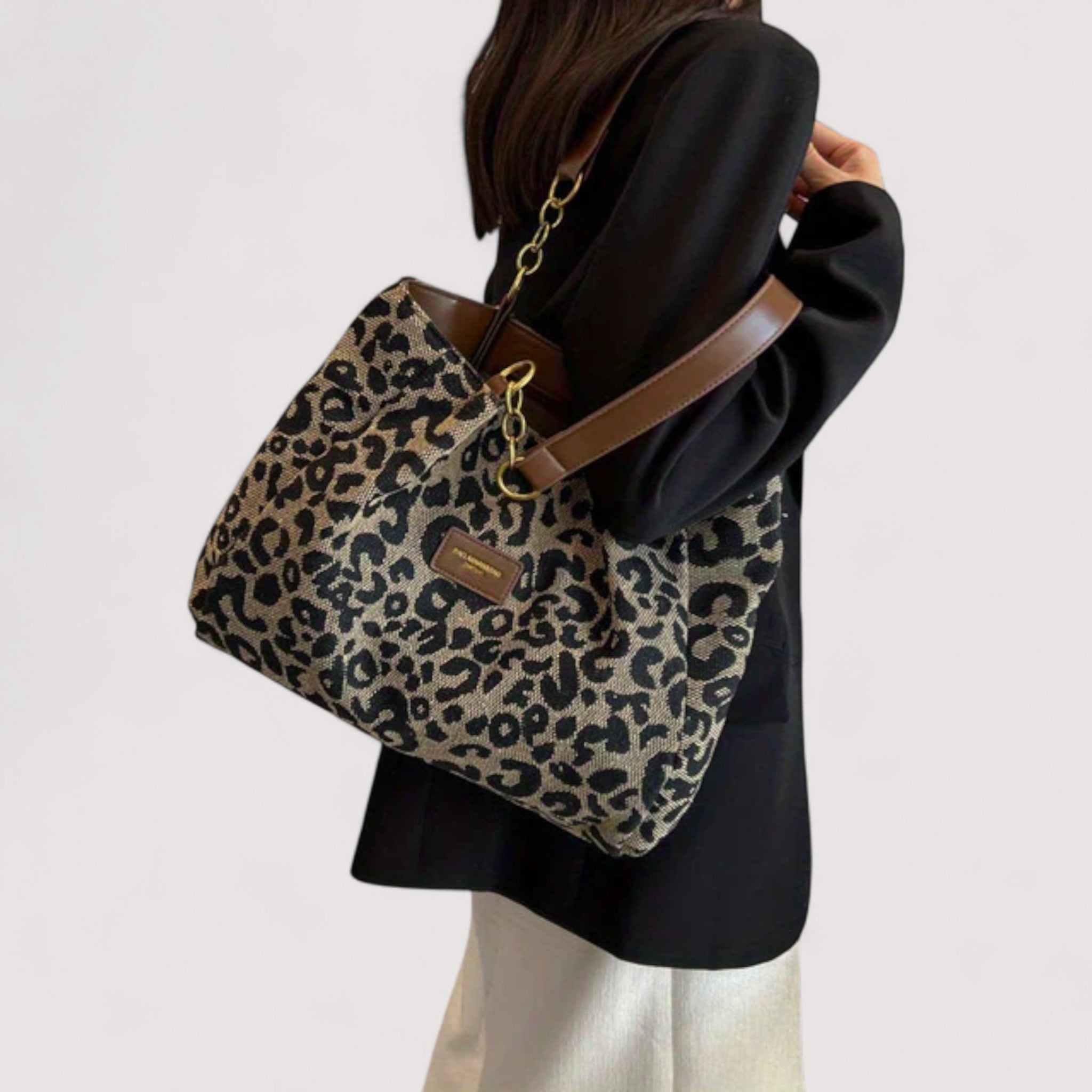 Victoria bold leopard print canvas shopping bag by Lumina Wear, showcasing a spacious tote with sturdy handles and vibrant animal pattern.