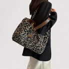 Victoria bold leopard print canvas shopping bag by Lumina Wear, showcasing a spacious tote with sturdy handles and vibrant animal pattern.