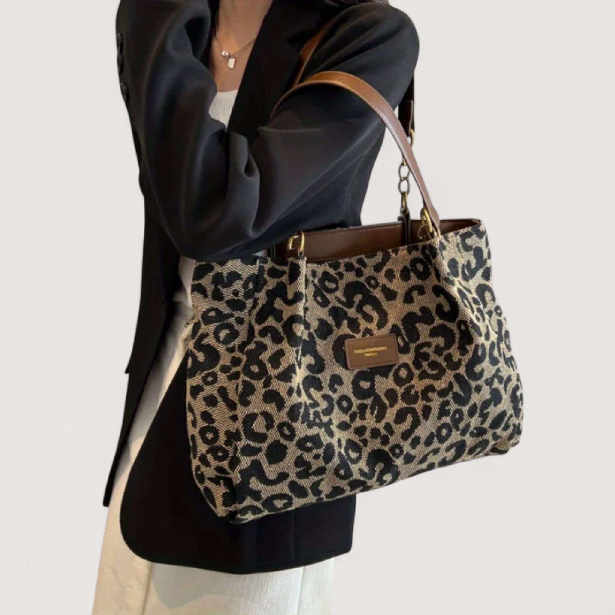 Lumina Wear Victoria leopard print canvas shopping bag with sturdy handles and spacious interior, stylish and functional.