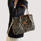 Lumina Wear Victoria leopard print canvas shopping bag with sturdy handles and spacious interior, stylish and functional.