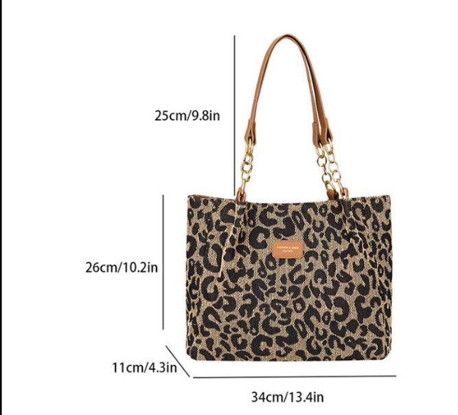 Victoria leopard print canvas shopping bag by Lumina Wear, stylish tote with bold animal print and sturdy handles.