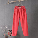 Victoria Lumina Wear casual white trousers with elastic waistband, featuring a relaxed fit and comfortable fabric for everyday wear.