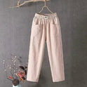 Victoria Lumina white casual trousers with elastic waistband, relaxed fit, and lightweight fabric for comfortable wear.