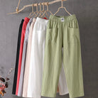 Victoria Lumina casual white trousers with elastic waistband, relaxed fit, soft fabric, and stylish comfort.