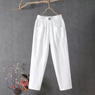 Victoria Lumina white casual trousers with elastic waistband, shown on a model, featuring a relaxed fit and comfortable style.