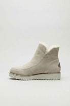 Chic beige ankle boots by Lumina Wear with durable sole, stylish design, and ankle height on a plain background.