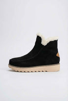 Victoria black ankle boots by Lumina Wear with warm lining, stylish design, and ankle-high silhouette on a neutral background.