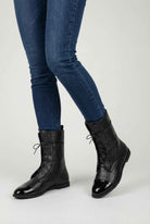 Black lace-up ankle boots with cozy lining from Lumina Wear, stylish women's footwear featuring a sleek design and comfortable fit.