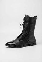 Black lace-up ankle boots with cozy lining by Lumina Wear, stylish women's footwear featuring a sleek design and comfortable fit.