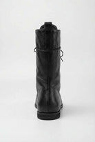 Black lace-up ankle boots with cozy lining from Lumina Wear, stylish women's boots featuring a sleek design and comfortable fit.