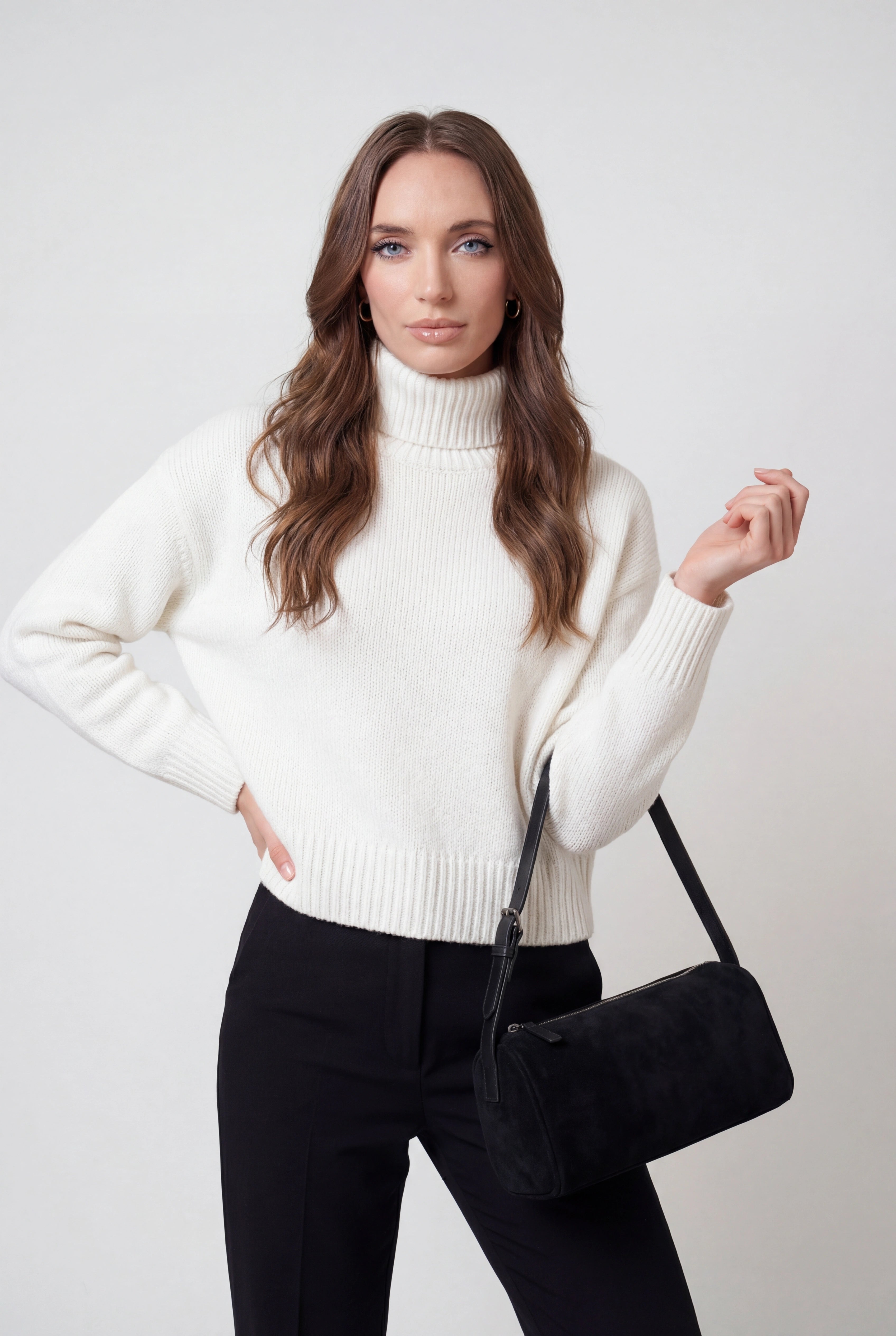 Victoria black mini shoulder handbag by Lumina Wear featuring an adjustable strap and sleek design.
