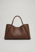 Lumina Wear Victoria black tote handbag with spacious pockets, stylish design, and sturdy handles for everyday use.